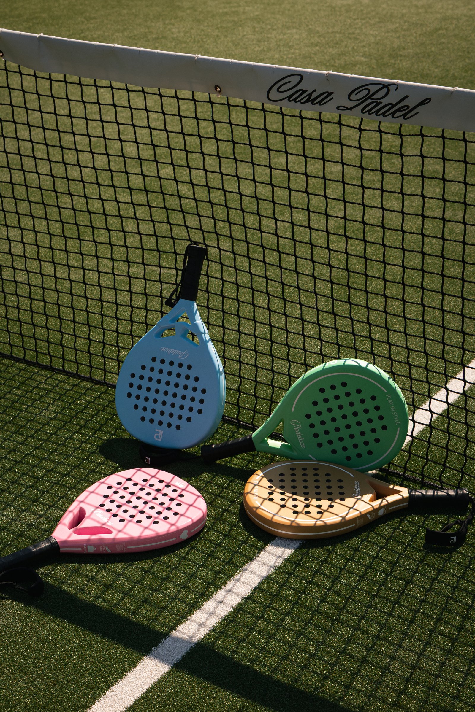 Padel court with rackets at Casa Padel Dubai